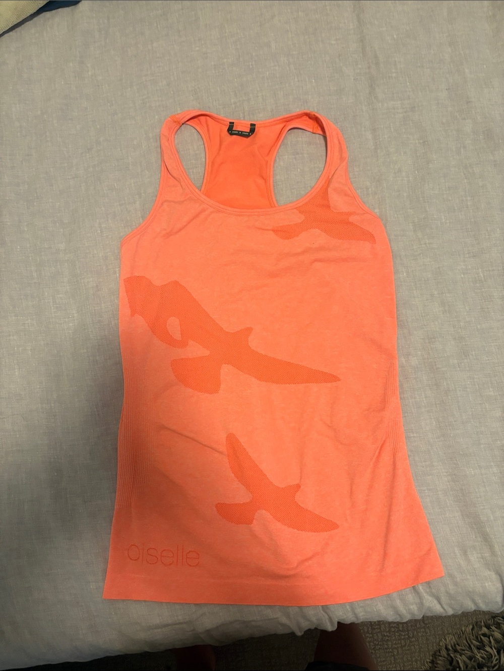oiselle orange racerback tank with bird motif